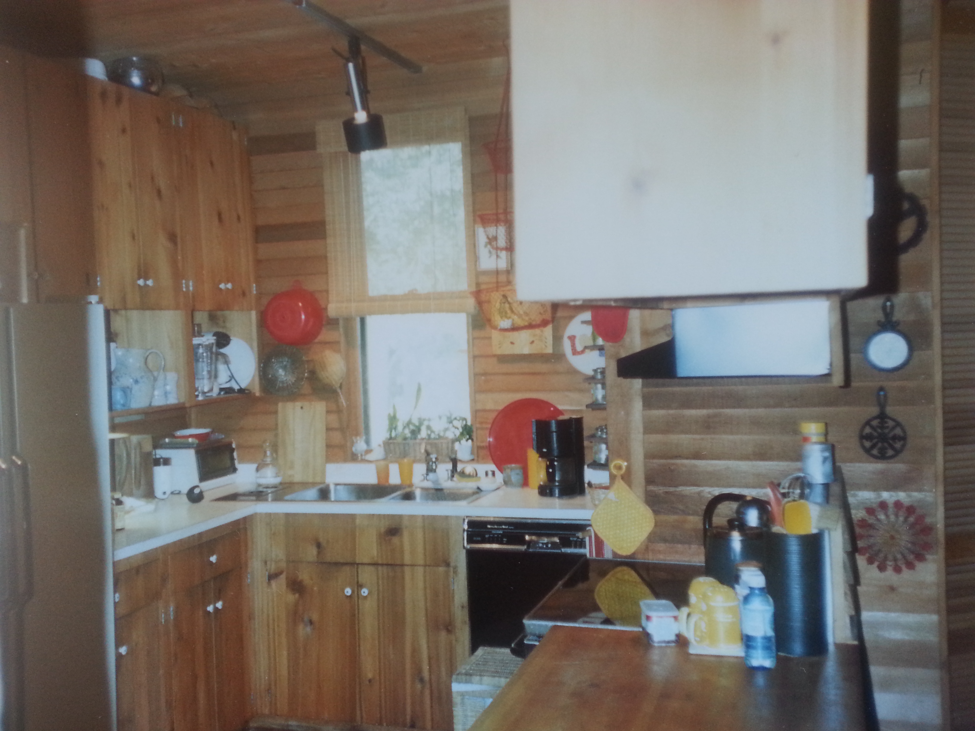 Mom's kitchen. It wasn't big but she always said we could cook together and never get in each others way.